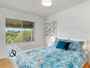 Letto o letti in una camera di Retro Groovy Pad Pt Elliot