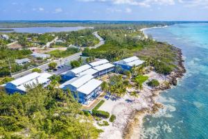 an aerial view of a resort on a island in the ocean at Beach Living at Moon Bay with SeaView in Bodden Town