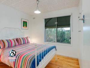 Letto o letti in una camera di Retro Groovy Pad Pt Elliot