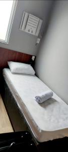Una cama o camas en una habitación de Hotel Platina