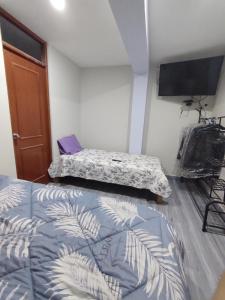 Postel nebo postele na pokoji v ubytování TRANSFER VIP HOSTEL
