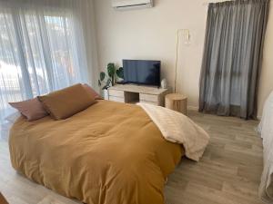 Letto o letti in una camera di Pāpāmoa Beach Studio Oasis