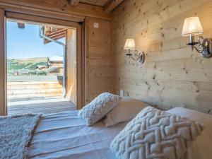 Кровать или кровати в номере Appartement 3 pièces au centre de l'Alpe d'Huez avec WIFI - FR-1-645-44