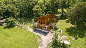 an overhead view of a small house in a field at Panoramic Paradise 3BR Cabin with Idyllic Views in Wartrace