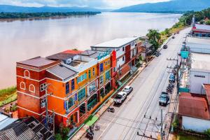 an aerial view of a building next to a river at Vera Costa Hotel in Nong Khai