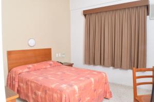 Postel nebo postele na pokoji v ubytování Hotel Delfines - a 2 calles del Acuario Veracruz