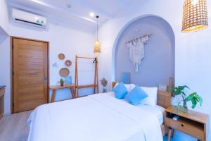 Postel nebo postele na pokoji v ubytování Nest House Homestay