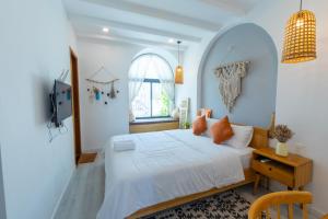 Postel nebo postele na pokoji v ubytování Nest House Homestay