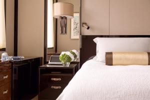 Letto o letti in una camera di The Peninsula Hong Kong