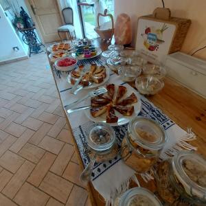 a table filled with food on top at Agritur Maso Spezial in Villa Lagarina