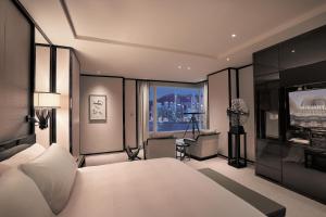 Letto o letti in una camera di The Peninsula Hong Kong