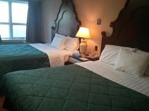 Rúm í herbergi á Port Motel +24 myndir