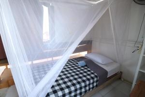 Postel nebo postele na pokoji v ubytování Seabreeze Hostel Bali