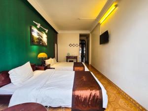 Postel nebo postele na pokoji v ubytování Nguyễn Hùng Hotel Sapa
