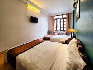 Postel nebo postele na pokoji v ubytování Nguyễn Hùng Hotel Sapa