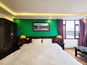 Postel nebo postele na pokoji v ubytování Nguyễn Hùng Hotel Sapa