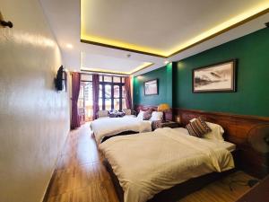 Postel nebo postele na pokoji v ubytování Nguyễn Hùng Hotel Sapa