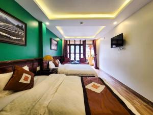 Postel nebo postele na pokoji v ubytování Nguyễn Hùng Hotel Sapa
