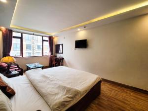 TV a/nebo společenská místnost v ubytování Nguyễn Hùng Hotel Sapa