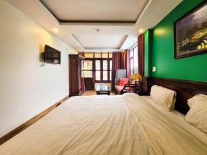 Postel nebo postele na pokoji v ubytování Nguyễn Hùng Hotel Sapa