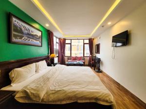 Postel nebo postele na pokoji v ubytování Nguyễn Hùng Hotel Sapa