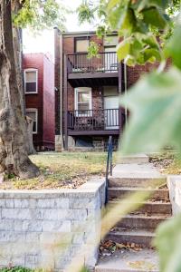 a brick building with stairs in front of it at Convenient 2 bedroom 1 bathroom in Saint Louis