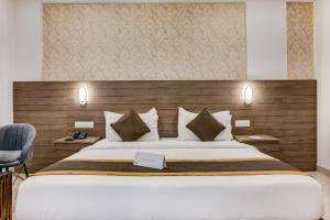 Katil atau katil-katil dalam bilik di Hotel Sterling Inn Bangalore International Airport
