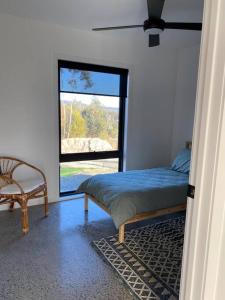 Ένα ή περισσότερα κρεβάτια σε δωμάτιο στο New home Family Retreat near Pambula 4bd 7guests