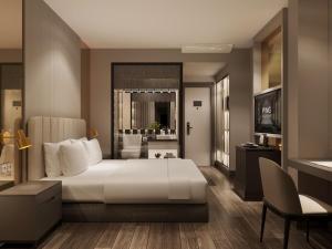 Voodi või voodid majutusasutuse Ping Hotel toas