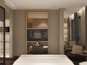 Voodi või voodid majutusasutuse Ping Hotel toas