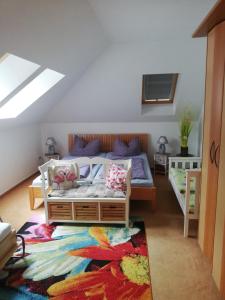 a bedroom with a bed and a rug at Haus Lebensart Bansin in Neu Sallenthin
