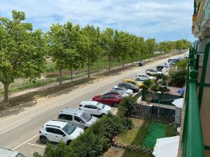 a row of cars parked in a parking lot at Appartement Empuriabrava in Empuriabrava