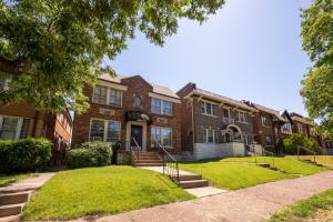 a large brick building with a staircase in front of it at 1 bedroom-City Livin in Saint Louis