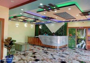 a lobby of a hotel with a bar in it at ST Apple Beach Resort Mandarmani in Mandarmoni