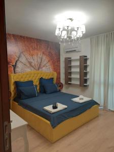 Un pat sau paturi într-o cameră la Sandanski Apartments Top Center