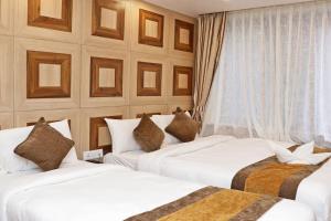 Letto o letti in una camera di Hotel Airport Gurkha