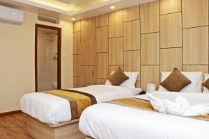 Letto o letti in una camera di Hotel Airport Gurkha