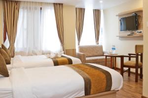 Letto o letti in una camera di Hotel Airport Gurkha