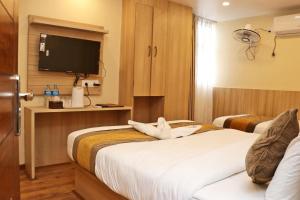 Letto o letti in una camera di Hotel Airport Gurkha