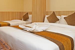 Letto o letti in una camera di Hotel Airport Gurkha