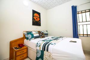 PRESTIGE Guesthouse ,Ksi客房内的一张或多张床位