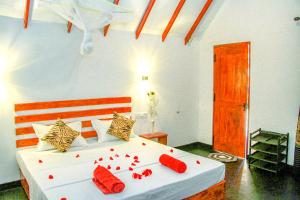 Letto o letti in una camera di Sigiri Enaya Cottage