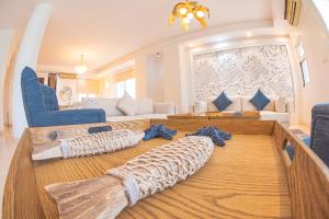 Posezení v ubytování Le Sifah - Marina View Apartments & Villa + 37 fotografií