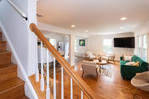 a living room with a staircase and a living room at Takoma Park Home ~ 6 Mi to the National Mall! in Takoma Park