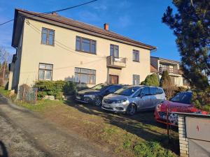 a group of cars parked in front of a house at Vila Galant in Konice