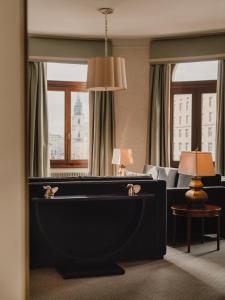 a living room with a pool table in a hotel room at Hotel Bristol, A Luxury Collection Hotel, Warsaw in Warsaw