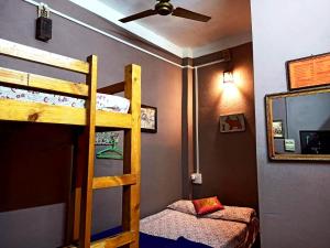 a bedroom with a bunk bed and a mirror at Stay Inn Heritage in Varanasi
