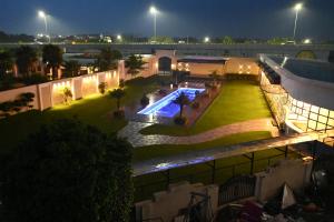 an overhead view of a building with a swimming pool at Deventure Hotel, Karnal in Karnal