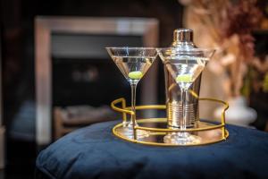 a hourglass with a ball in it sitting on a table at City Escape Waterford City Sleeps 6 in Waterford