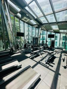 a gym with a lot of exercise equipment in a building at City center residents Pool view in Pattaya Central